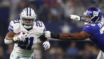 LWS141. Arlington (United States), 10/09/2017.- Dallas Cowboys running back Ezekiel Elliott (L) runs the ball against New York Giants defensive end Romeo Okwara (R) of Nigeria in the second half of the NFL American football game between the New York Giants and the Dallas Cowboys at AT&amp;T Stadium in Arlington, Texas, USA, 10 September 2017. (Roma, Nueva York, Estados Unidos) EFE/EPA/LARRY W. SMITH