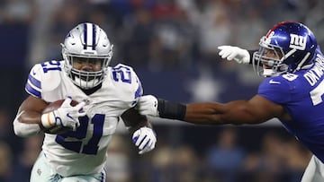LWS141. Arlington (United States), 10/09/2017.- Dallas Cowboys running back Ezekiel Elliott (L) runs the ball against New York Giants defensive end Romeo Okwara (R) of Nigeria in the second half of the NFL American football game between the New York Giants and the Dallas Cowboys at AT&T Stadium in Arlington, Texas, USA, 10 September 2017. (Roma, Nueva York, Estados Unidos) EFE/EPA/LARRY W. SMITH