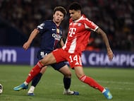 Paris Saint-Germain's Portuguese midfielder #87 Joao Neves fights for the ball with Bayern Munich's Colombian forward #14 Luis Diaz during the UEFA Champions League semi-final first leg football match between Paris Saint-Germain (PSG) and Bayern Munich at the Parc des Princes in Paris on April 28, 2026. (Photo by FRANCK FIFE / AFP)