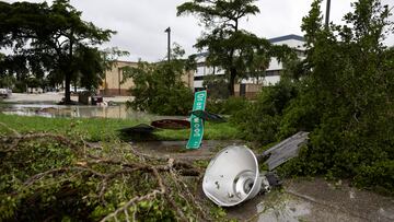 A downed street sign and debris lie scattered after a passing tornado affected the area as Hurricane Milton approaches Fort Myers, Florida, U.S. October 9, 2024. REUTERS/Ricardo Arduengo