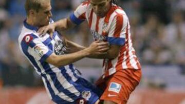 El Atl¨¦tico asegura la Champions en un final pol¨¦mico
