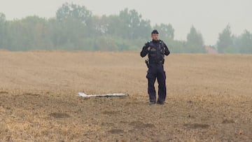 A Polish police officer stands near a unmanned aerial vehicle (UAV) fragment, after Russian drones violated Polish airspace during an attack on Ukraine and some were shot down by Poland, in Czesniki, Lublin Voivodeship, Poland, September 10, 2025 in this still image from video. Polsat News via REUTERS THIS IMAGE HAS BEEN SUPPLIED BY A THIRD PARTY. POLAND OUT. NO COMMERCIAL OR EDITORIAL SALES IN POLAND TPX IMAGES OF THE DAY
