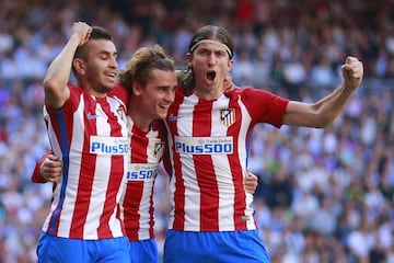 Antoine Griezmann of Atletico de Madrid celebrates scoring their opening goal with teammates Angel Martin Correa and Filipe Luis