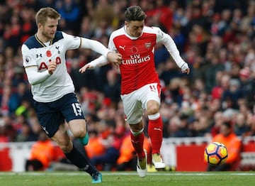 Mesut Ozil on the ball against Tottenham's Eric Dier.