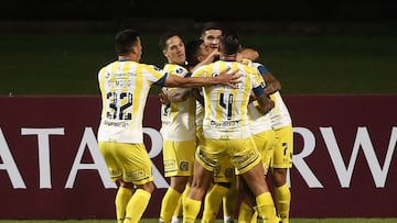 Photo released by Photosport of Argentina's Rosario Central Diego Zabala (hidden) celebrating with teammates after scoring against Chile's Huachipato during the Copa Sudamericana football tournament group stage match at Sausalito Stadium in Vina