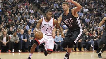 Jan 13, 2017; Toronto, Ontario, CAN; Toronto Raptors guard Kyle Lowry (7) controls a ball as Brooklyn Nets center Brook Lopez (11) tries to defend during the second quarter in a game at Air Canada Centre. The Toronto Raptors won 132-113. Mandatory Credit: Nick Turchiaro-USA TODAY Sports