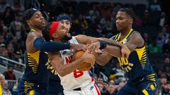 Dec 10, 2022; Indianapolis, Indiana, USA; Brooklyn Nets guard Patty Mills (8) ties up the ball against Indiana Pacers guard Buddy Hield (24) and guard Bennedict Mathurin (00) in the second half at Gainbridge Fieldhouse. Mandatory Credit: Trevor Ruszkowski-USA TODAY Sports
