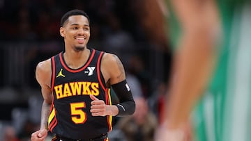 ATLANTA, GEORGIA - MARCH 28: Dejounte Murray #5 of the Atlanta Hawks reacts after a basket against Kristaps Porzingis #8 of the Boston Celtics during overtime at State Farm Arena on March 28, 2024 in Atlanta, Georgia. NOTE TO USER: User expressly acknowledges and agrees that, by downloading and/or using this photograph, user is consenting to the terms and conditions of the Getty Images License Agreement. Kevin C. Cox/Getty Images/AFP (Photo by Kevin C. Cox / GETTY IMAGES NORTH AMERICA / Getty Images via AFP)