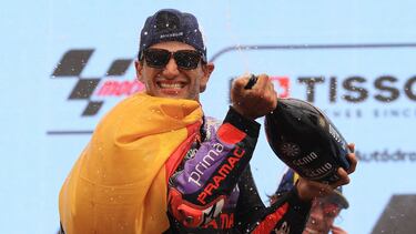 Ducati Spanish rider Jorge Martin celebrates with champagne on the podium after winning the MotoGP race of the Portuguese Grand Prix at the Algarve International Circuit in Portimao on March 24, 2024. (Photo by PATRICIA DE MELO MOREIRA / AFP)