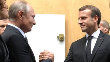 FILED - 30 September 2019, France, Paris: French President Emmanuel Macron greets Russian President Vladimir Putin before the funeral service of former French President Jacques Chirac at the Saint Sulpice de la Madeleine Church. French President Emmanuel 
