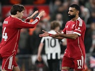 Liverpool's Egyptian striker #11 Mohamed Salah (R) is substituted for Liverpool's Italian striker #14 Federico Chiesa (L) during the English Premier League football match between Liverpool and Newcastle United at Anfield in Liverpool, north west England on January 31, 2026. (Photo by Paul ELLIS / AFP) / RESTRICTED TO EDITORIAL USE. No use with unauthorized audio, video, data, fixture lists, club/league logos or 'live' services. Online in-match use limited to 120 images. An additional 40 images may be used in extra time. No video emulation. Social media in-match use limited to 120 images. An additional 40 images may be used in extra time. No use in betting publications, games or single club/league/player publications. /