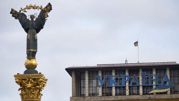 KYIV, UKRAINE - FEBRUARY 23: The independence monument on Maidan Square and Hotel Ukraine on February 23, 2022 in Kyiv, Ukraine. The country prepared to declare a state of emergency and called upon reservists to return to active duty in response to a loom