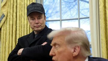 FILE PHOTO: Elon Musk listens to U.S. President Donald Trump speak in the Oval Office of the White House in Washington, D.C., U.S., February 11, 2025. REUTERS/Kevin Lamarque/File Photo