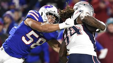 New England Patriots wide receiver Cordarrelle Patterson (84) is grabbed at by Buffalo Bills linebacker Matt Milano (58) during the first half of an NFL football game, Monday, Oct. 29, 2018, in Orchard Park, N.Y. (AP Photo/Adrian Kraus)