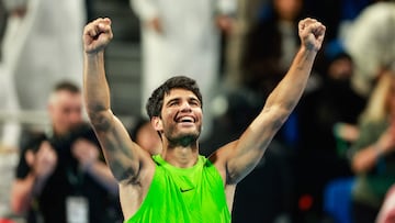 Spain's Carlos Alcaraz celebrates after winning his men�s singles final match against France's Arthur Fils at the Qatar Open tennis tournament in Doha on February 21, 2026. (Photo by Karim JAAFAR / AFP)