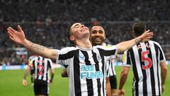 NEWCASTLE UPON TYNE, ENGLAND - OCTOBER 29: Goalscorer Miguel Almiron celebrates after scoring the fourth Newcastle goal with Callum Wilson during the Premier League match between Newcastle United and Aston Villa at St. James Park on October 29, 2022 in Newcastle upon Tyne, England. (Photo by Stu Forster/Getty Images)