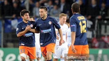 Montpellier's Argentinian forward Emmanuel Herrera (R) is congratulated by teammate Chilean midfielder Marco Estrada.