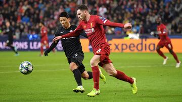 SALZBURG, AUSTRIA - DECEMBER 10: Andy Robertson of Liverpool under pressure from Hwang Hee-chan of Red Bull Salzburg  during the UEFA Champions League group E match between RB Salzburg and Liverpool FC at Red Bull Arena on December 10, 2019 in Salzburg, A