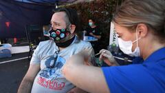 BRISBANE, AUSTRALIA - OCTOBER 16: Shaun Fenwick receives the Covid-19 vaccine outside a Bunnings hardware store on October 16, 2021 in Brisbane, Australia. The Queensland state government is hosting pop-up vaccination clinics at Bunnings stores around the