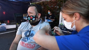 BRISBANE, AUSTRALIA - OCTOBER 16: Shaun Fenwick receives the Covid-19 vaccine outside a Bunnings hardware store on October 16, 2021 in Brisbane, Australia. The Queensland state government is hosting pop-up vaccination clinics at Bunnings stores around the