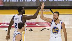 May 14, 2017; Oakland, CA, USA; Golden State Warriors forward Draymond Green (23) high fives guard Stephen Curry (30) after a basket against the San Antonio Spurs during the fourth quarter in game one of the Western conference finals of the 2017 NBA Playoffs at Oracle Arena. Mandatory Credit: Kelley L Cox-USA TODAY Sports