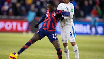 Jan 27, 2022; Columbus, Ohio, USA; United States forward Tim Weah (21) dribbles the ball while El Salvador midfielder Bryan Landaverde (8) defends during a CONCACAF FIFA World Cup Qualifier soccer match at Lower.com Field. Mandatory Credit: Trevor Ruszkow