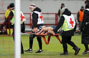 Filipe Luis is carried off on a stretcher