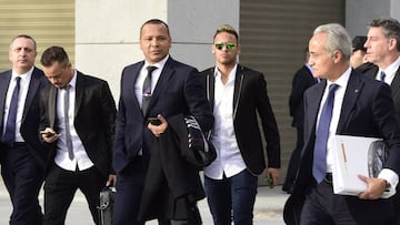 Neymar arrives at court with his father and advisers.