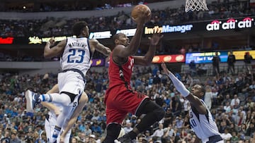 Mar 25, 2017; Dallas, TX, USA; Toronto Raptors forward Serge Ibaka (9) drives to the basket past Dallas Mavericks guard Wesley Matthews (23) and forward Harrison Barnes (40) during the second half at the American Airlines Center. The Raptors defeat the Mavericks 94-86. Mandatory Credit: Jerome Miron-USA TODAY Sports