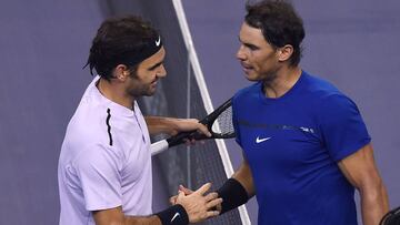 Roger Federer of Switzerland (L) is congratulated by Rafael Nadal of Spain after their men's singles final match at the Shanghai Masters tennis tournament in Shanghai on October 15, 2017. / AFP PHOTO / Chandan KHANNA