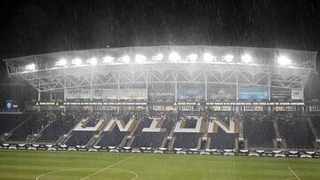 CHESTER, PENNSYLVANIA - JULY 28: Fans take cover during a stoppage in play due to a thunderstorm during the game between Wrexham AFC and Philadelphia Union II at Subaru Park on July 28, 2023 in Chester, Pennsylvania.   Drew Hallowell/Getty Images/AFP (Photo by Drew Hallowell / GETTY IMAGES NORTH AMERICA / Getty Images via AFP)