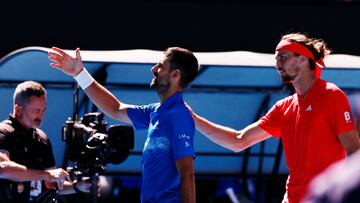 Tennis - Australian Open - Melbourne Park, Melbourne, Australia - January 24, 2025 Serbia's Novak Djokovic shakes hands with the umpire after retiring from his semi final match against Germany's Alexander Zverev REUTERS/Tingshu Wang