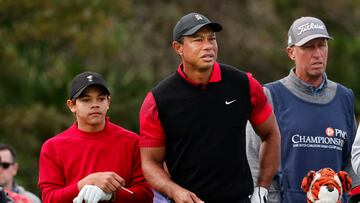 Dec 18, 2022; Orlando, Florida, USA; Caddy for Justin Thomas( not pictured) Jim “Bones” Mackay (right) looks on as Tiger Woods and son Charlie Woods (left) study their drive on the third tee during the final round of the PNC Championship golf tournament at Ritz Carlton Golf Club Grande Lakes Orlando Course. Mandatory Credit: Reinhold Matay-USA TODAY Sports