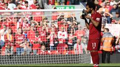Liverpool&#039;s Egyptian midfielder Mohamed Salah celebrates after being awarded the golden boot award for most goals scored in the season after the English Premier League football match between Liverpool and Brighton and Hove Albion at Anfield in Liverpool, north west England on May 13, 2018. / AFP PHOTO / Paul ELLIS / RESTRICTED TO EDITORIAL USE. No use with unauthorized audio, video, data, fixture lists, club/league logos or &#039;live&#039; services. Online in-match use limited to 75 images, no video emulation. No use in betting, games or single club/league/player publications.  / 