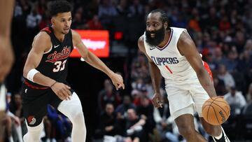 LA Clippers guard James Harden (1) dribbles past Portland Trail Blazers forward Toumani Camara (33).