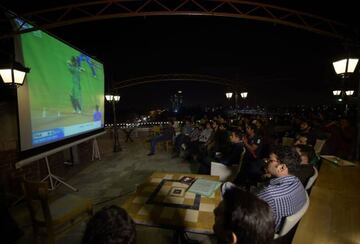 Pakistani cricket fans watch the game