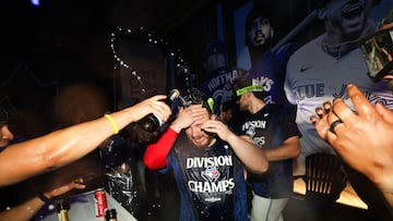 TORONTO, CANADA - SEPTEMBER 28: Alejandro Kirk #30 of the Toronto Blue Jays celebrates in the locker room with teammates after clinching the AL East division after their MLB game against the Tampa Bay Rays at Rogers Centre on September 28, 2025 in Toronto, Ontario, Canada. Cole Burston/Getty Images/AFP (Photo by Cole Burston / GETTY IMAGES NORTH AMERICA / Getty Images via AFP)