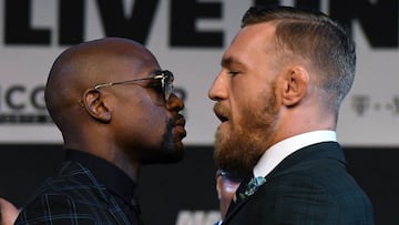 LAS VEGAS, NV - AUGUST 23: Boxer Floyd Mayweather Jr. (L) and UFC lightweight champion Conor McGregor face off during a news conference at the KA Theatre at MGM Grand Hotel &amp; Casino on August 23, 2017 in Las Vegas, Nevada. The two will meet in a super welterweight boxing match at T-Mobile Arena on August 26 in Las Vegas.   Ethan Miller/Getty Images/AFP
 == FOR NEWSPAPERS, INTERNET, TELCOS &amp; TELEVISION USE ONLY ==