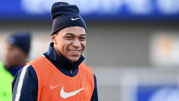 France's forward Kylian MBappe smiles during a training session in Clairefontaine en Yvelines on March 20, 2018, as part of the team's preparation for the friendly football match against Colombia and Russia. / AFP PHOTO / FRANCK FIFE