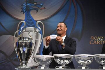 Netherlands' former striker Ruud Gullit shows the name of Barcelona during the draw for the round of 16 of the UEFA Champions League football in December 12, 2016.