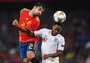 SEVILLE, SPAIN - OCTOBER 15: Jonny of Spain outjumps Raheem Sterling of England during the UEFA Nations League A Group Four match between Spain and England at Estadio Benito Villamarin on October 15, 2018 in Seville, Spain.