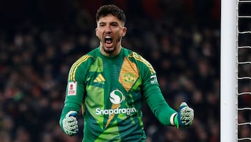 Manchester United's Turkish goalkeeper #01 Altay Bayindir reacts after saving the penalty of Arsenal's German midfielder #29 Kai Havertz during a penalty shoot out during the English FA Cup third round football match between Arsenal and Manchester United at the Emirates Stadium in London on January 12, 2025. (Photo by Ian Kington / IKIMAGES / AFP) / RESTRICTED TO EDITORIAL USE. No use with unauthorized audio, video, data, fixture lists, club/league logos or 'live' services. Online in-match use limited to 45 images, no video emulation. No use in betting, games or single club/league/player publications.