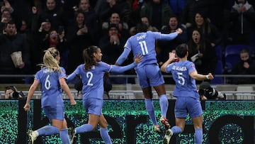 France's forward #11 Kadidiatou Diani (2ndR) celebrates with teammates after she scored his team's first goal during the UEFA Women's Nations League football match between France and Germany at The Groupama Stadium in Decines-Charpieu, central-eastern France on February 23, 2024. (Photo by FRANCK FIFE / AFP)