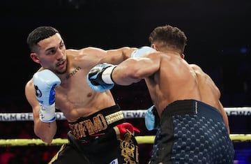 Teófimo Lopez (left) exchanges punches with Jamaine Ortiz during the pair's WBO light welterweight title fight in February.