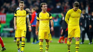 Borussia Dortmund&#039;s Marco Reus, Mario Goetze and Lukasz Piszczek react after the match 