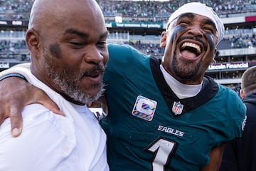 Oct 13, 2024; Philadelphia, Pennsylvania, USA; Philadelphia Eagles quarterback Jalen Hurts (1) shares a laugh with Cleveland Browns running backs coach Duce Staley after an Eagles victory at Lincoln Financial Field. Mandatory Credit: Bill Streicher-Imagn Images