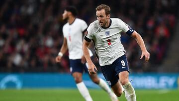 (FILES) In this file photograph taken on October 12, 2021, England's striker Harry Kane runs with the ball during the FIFA World Cup 2022 qualifying match between England and Hungary at Wembley Stadium in London. (Photo by Ben STANSALL / AFP) / NOT FOR MARKETING OR ADVERTISING USE / RESTRICTED TO EDITORIAL USE