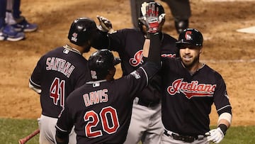 CHICAGO, IL - OCTOBER 29: Rajai Davis #20, Carlos Santana #41, and Coco Crisp #4 of the Cleveland Indians congratulate Jason Kipnis #22 after Kipnis hit a home run in the seventh inning against the Chicago Cubs in Game Four of the 2016 World Series at Wrigley Field on October 29, 2016 in Chicago, Illinois. Elsa/Getty Images/AFP
== FOR NEWSPAPERS, INTERNET, TELCOS & TELEVISION USE ONLY ==