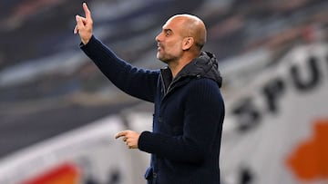 Manchester City&#039;s Spanish manager Pep Guardiola gestures on the touchline during the English Premier League football match between Tottenham Hotspur and Manchester City at Tottenham Hotspur Stadium in London, on November 21, 2020. (Photo by NEIL HALL