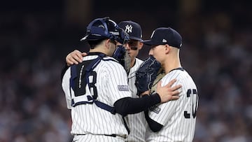 NEW YORK, NEW YORK - OCTOBER 30: Luke Weaver #30 of the New York Yankees receives a mound visit during the ninth inning of Game Five of the 2024 World Series at Yankee Stadium on October 30, 2024 in New York City. Sarah Stier/Getty Images/AFP (Photo by Sarah Stier / GETTY IMAGES NORTH AMERICA / Getty Images via AFP)